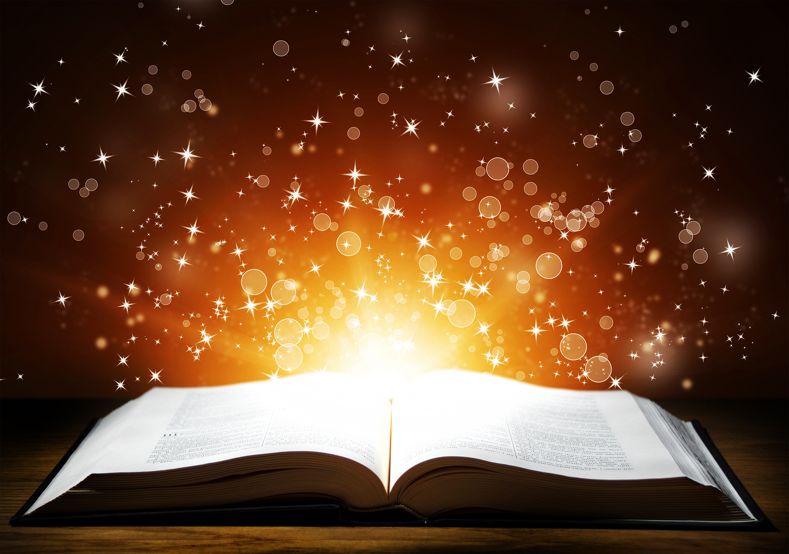 bigstock-Old-open-book-with-magic-light-55622912